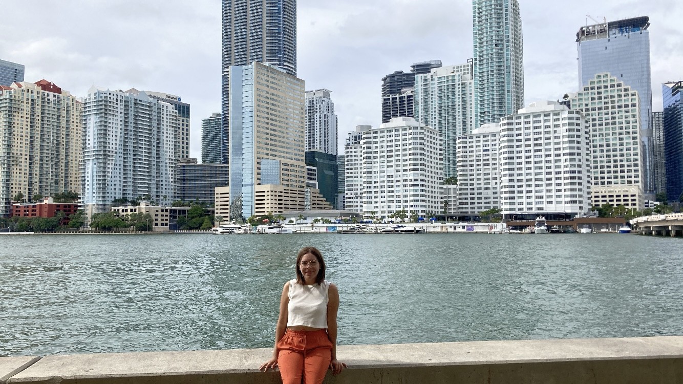 anette paleo-navarro poses in front of buildings 