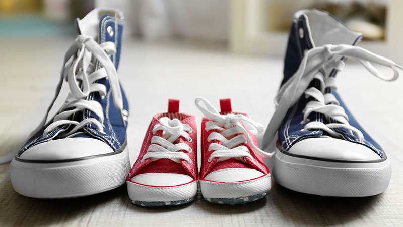 image of adult and child sneakers to represent child and father